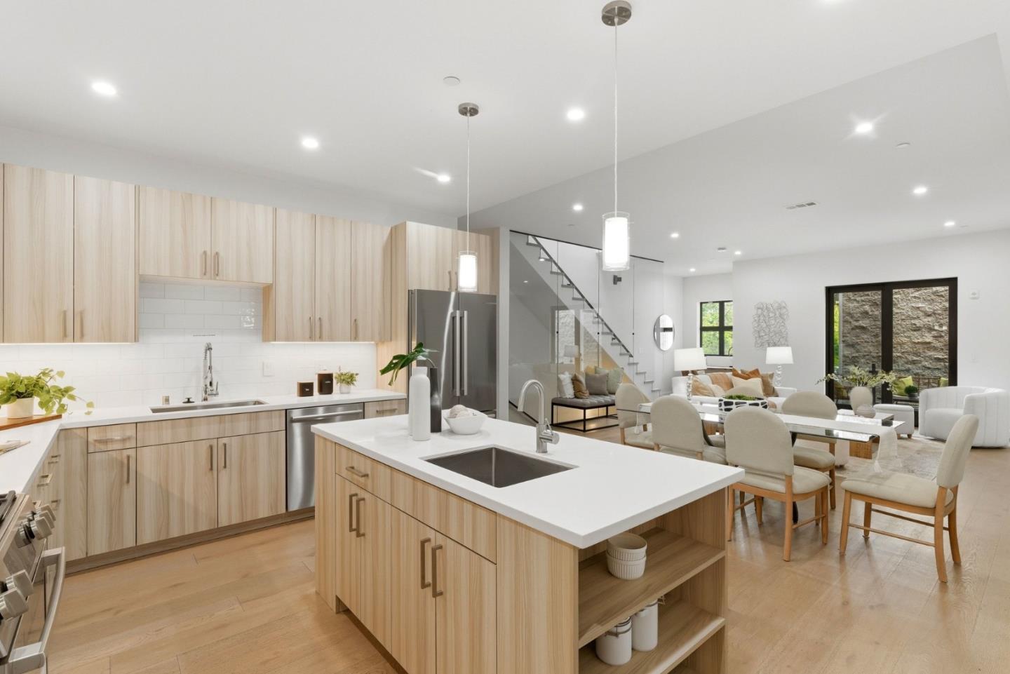 922 Woodside Road Redwood City, CA 94061 - Photo 15 of 30 a kitchen with a sink a stove and chairs