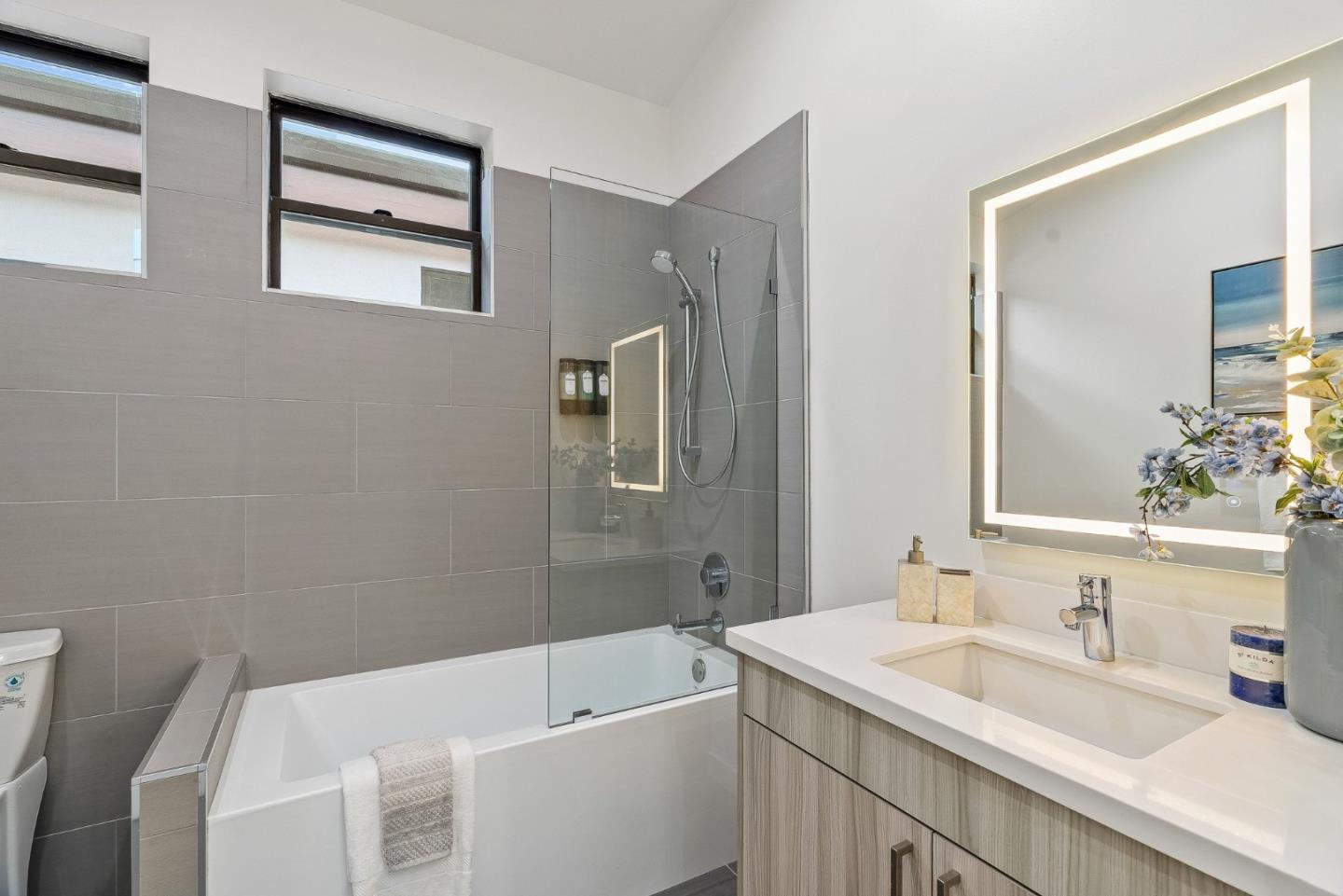 922 Woodside Road Redwood City, CA 94061 - Photo 20 of 30 a bathroom with a sink and a bathtub