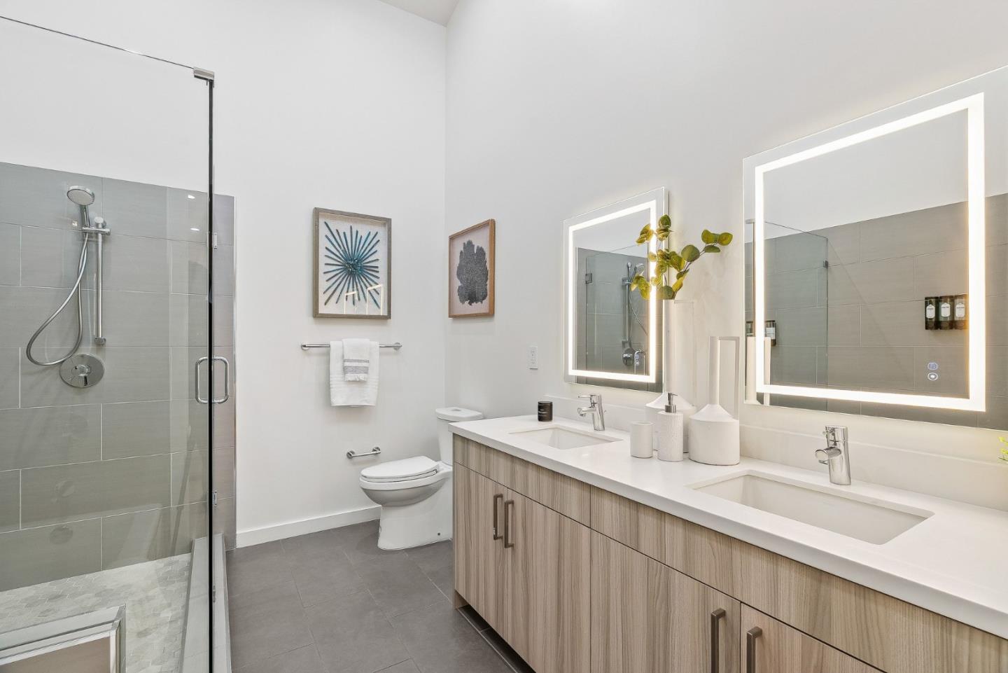 922 Woodside Road Redwood City, CA 94061 - Photo 23 of 30 a bathroom with a double vanity sink toilet and shower