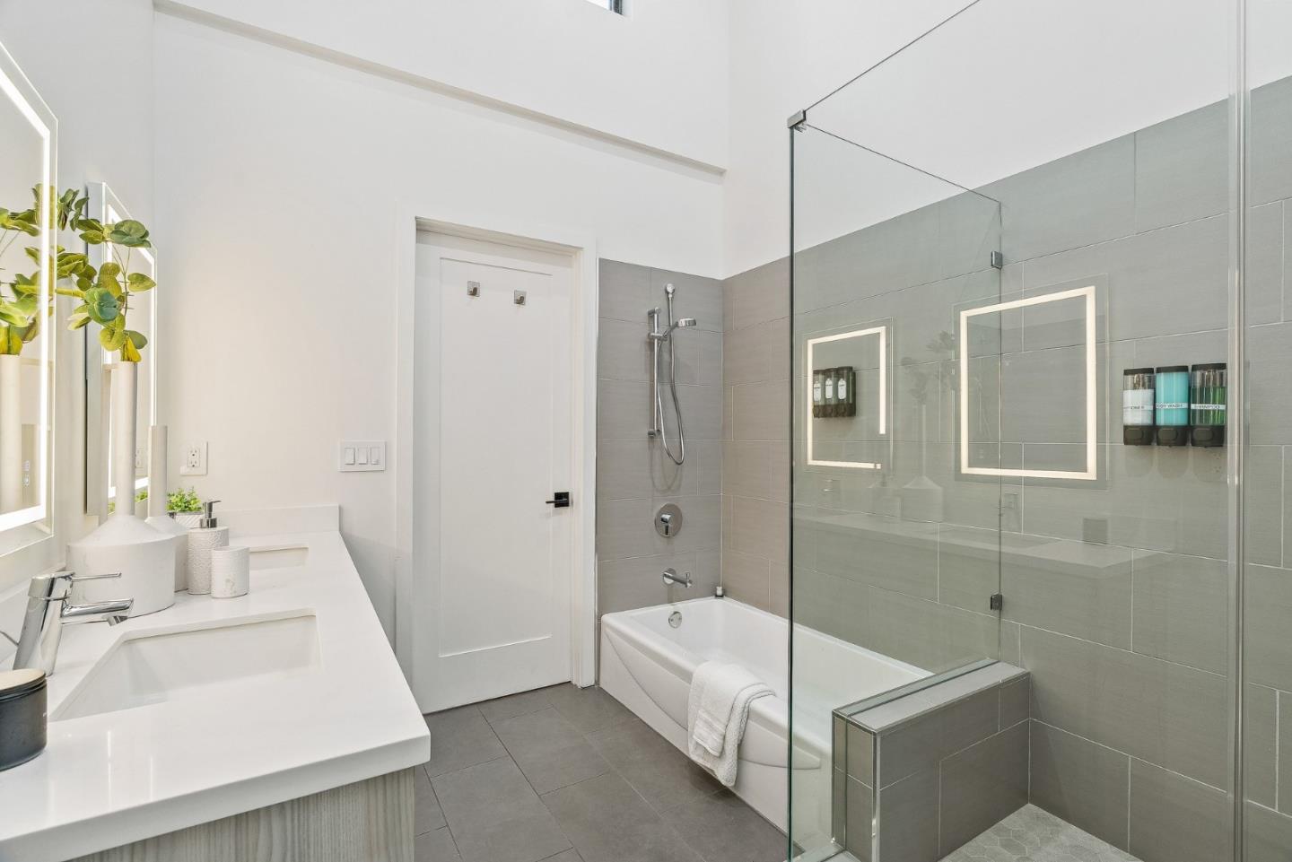 922 Woodside Road Redwood City, CA 94061 - Photo 24 of 30 a bathroom with a tub sink and mirror