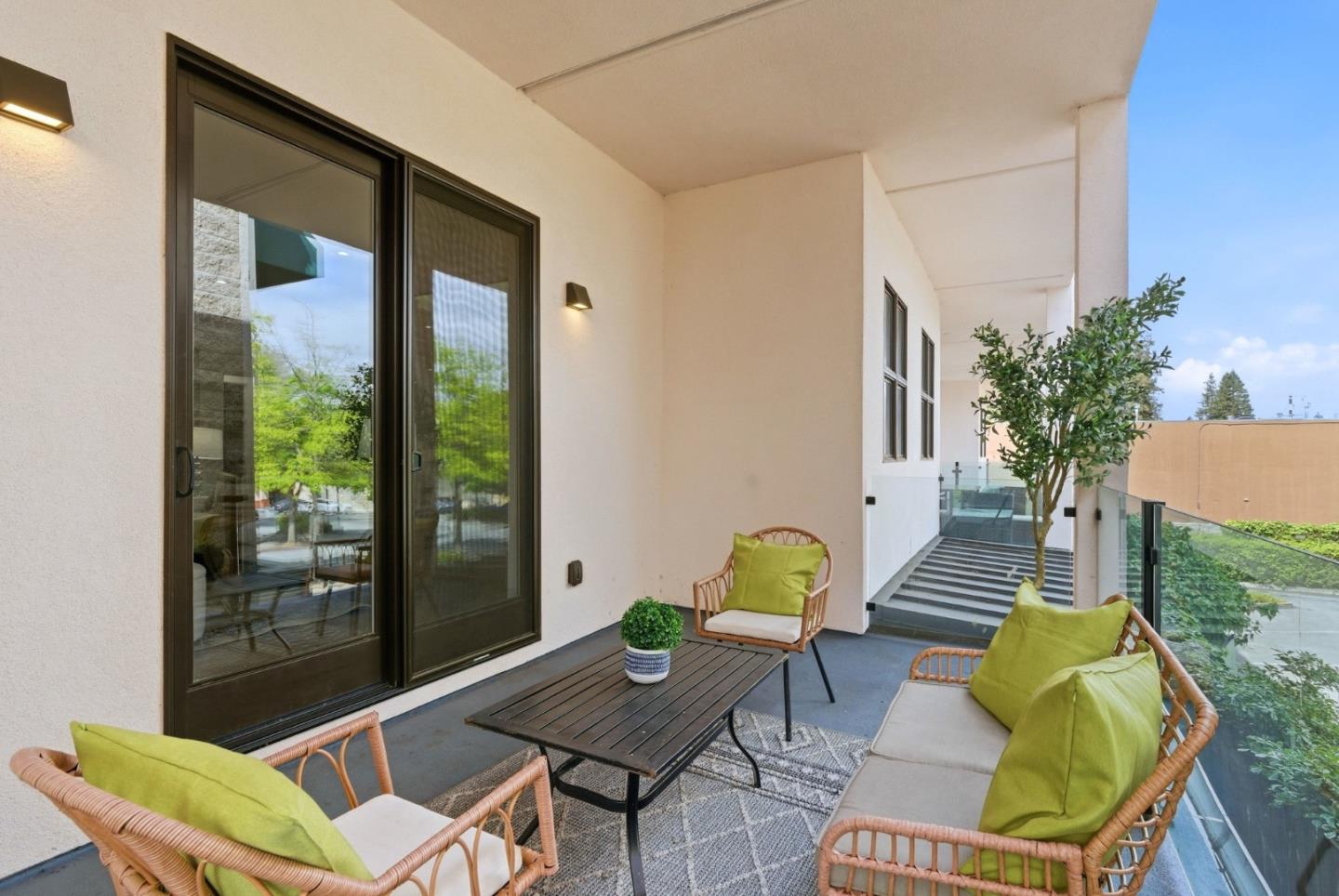 922 Woodside Road Redwood City, CA 94061 - Photo 26 of 30 a outdoor space with patio couch and a potted plant