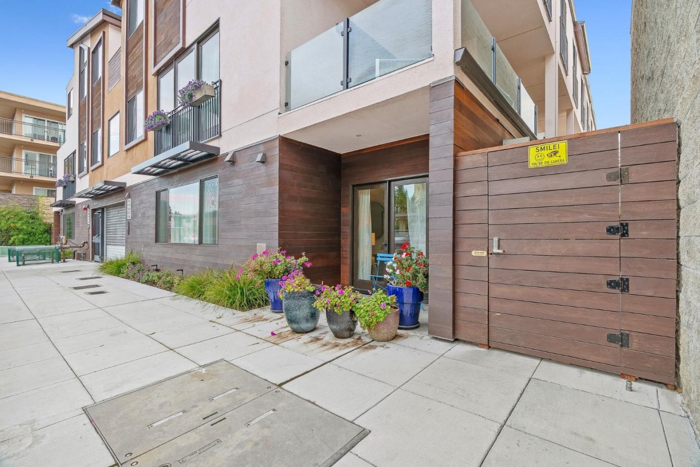 922 Woodside Road Redwood City, CA 94061 - Photo 3 of 30 a view of a pathway along the building