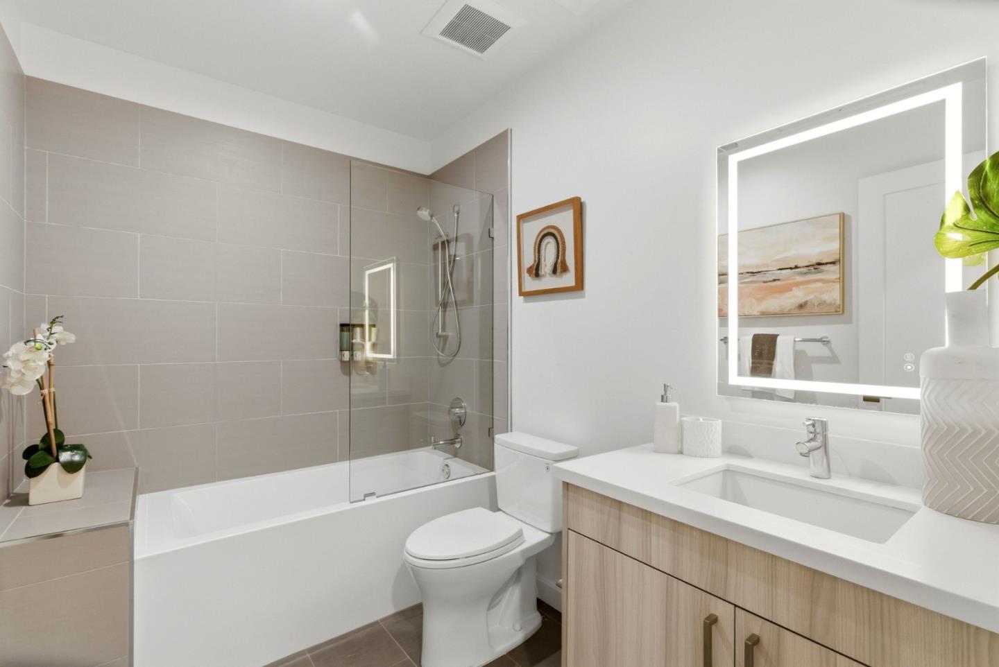 922 Woodside Road Redwood City, CA 94061 - Photo 7 of 30 a bathroom with a sink a toilet and shower