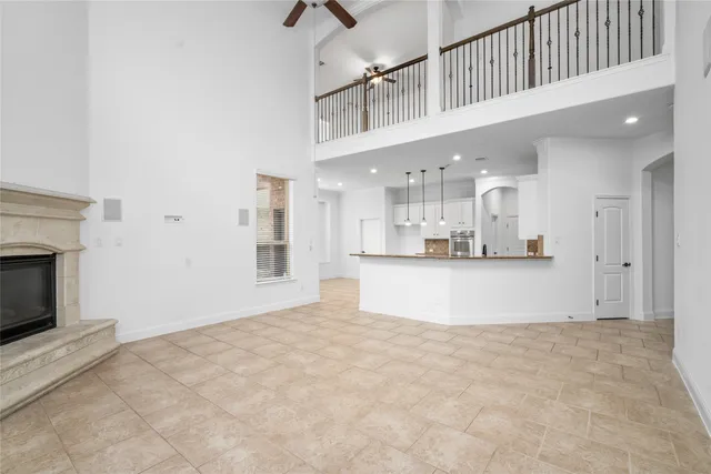 a view of kitchen and kitchen with granite countertop stove top oven