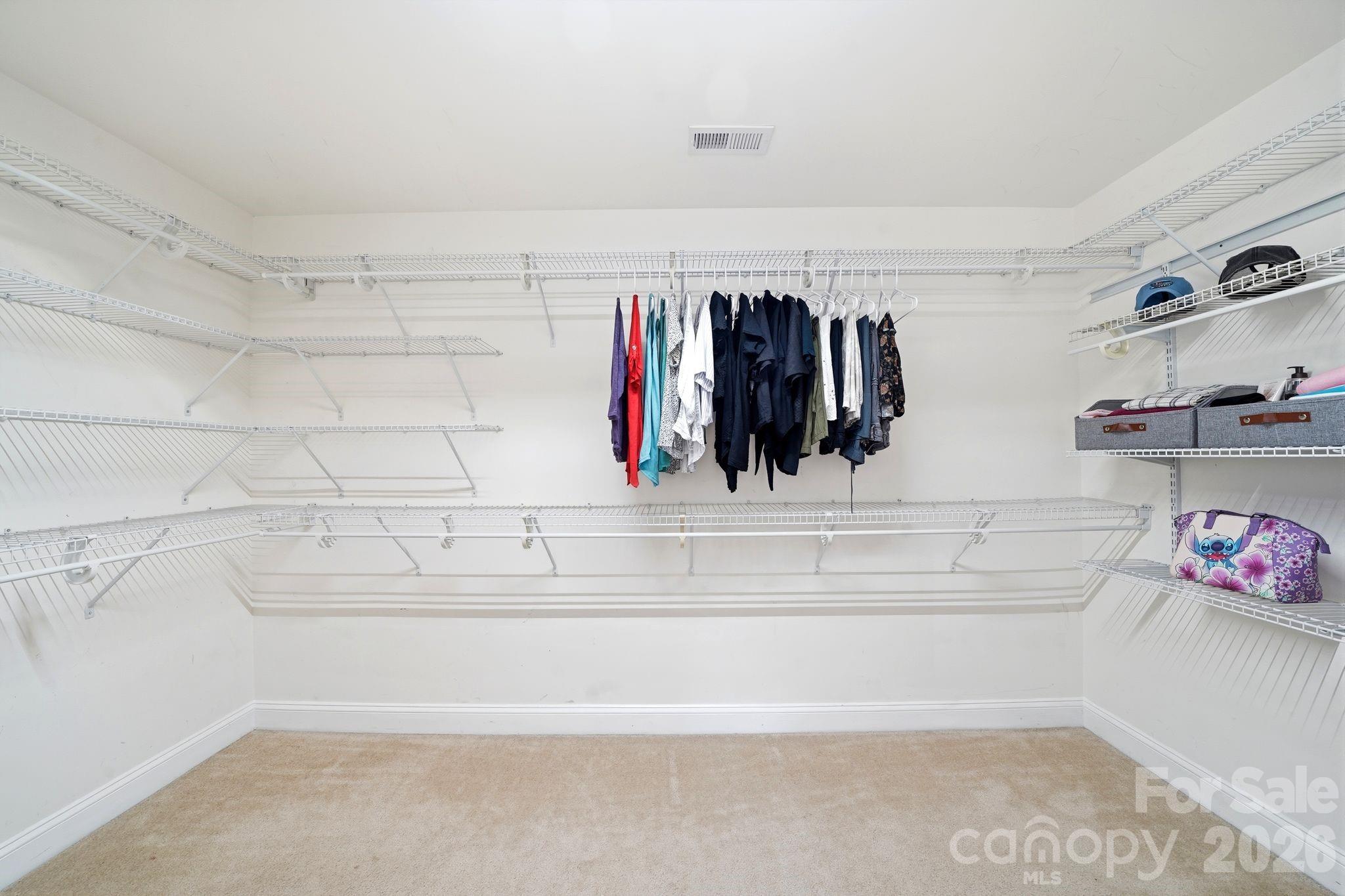 7815 Kuck Road Mint Hill, NC 28227 - Photo 19 of 29 a view of walk in closet with clothes and shoes