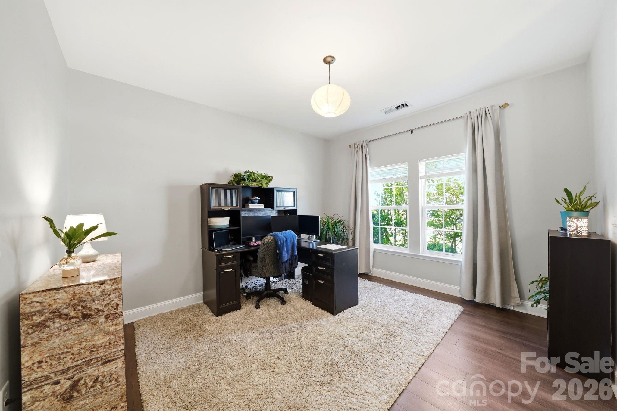 7815 Kuck Road Mint Hill, NC 28227 - Photo 3 of 29 a view of a workspace with furniture and a window
