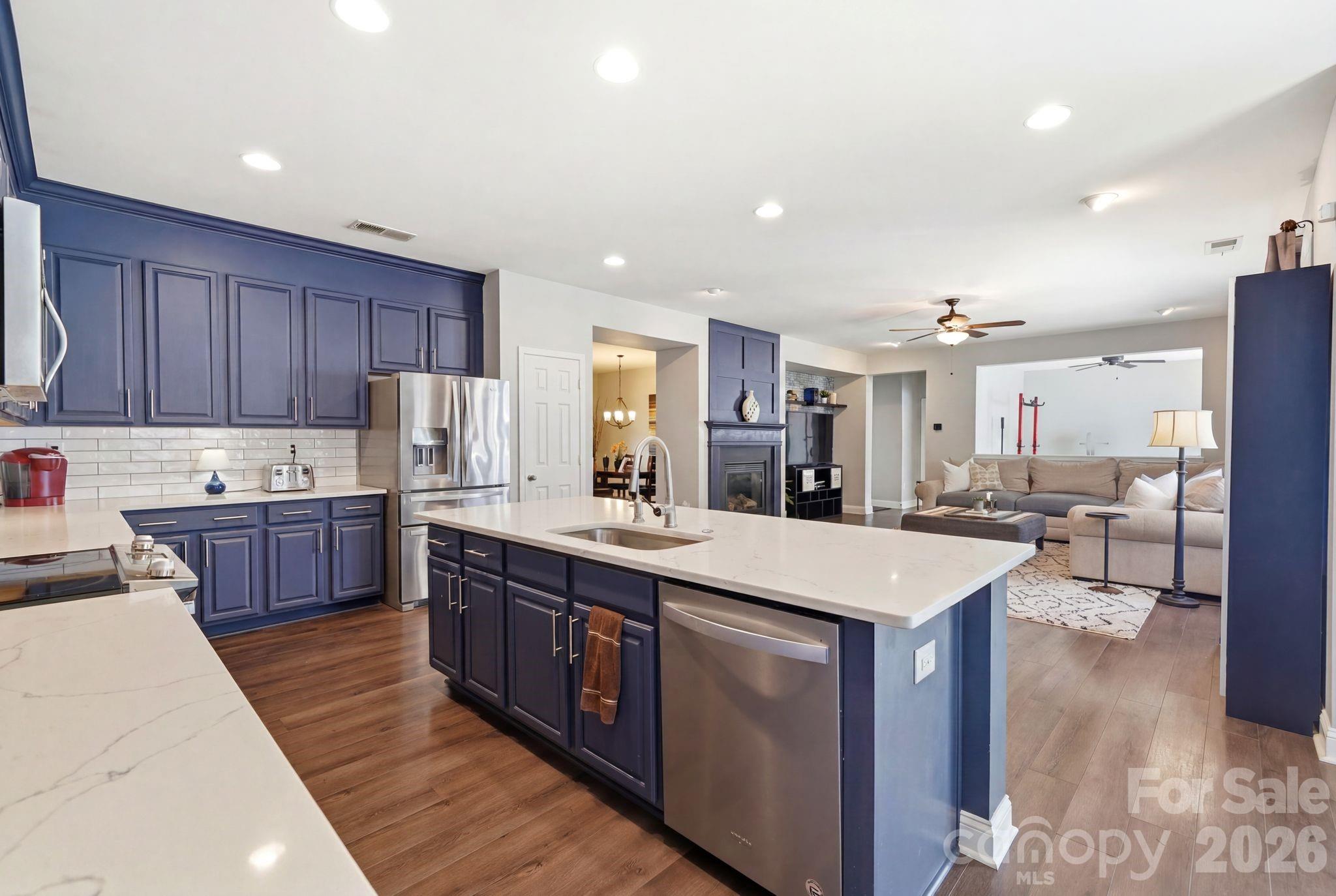 7815 Kuck Road Mint Hill, NC 28227 - Photo 7 of 29 a kitchen with stainless steel appliances granite countertop a stove a sink a refrigerator and a oven
