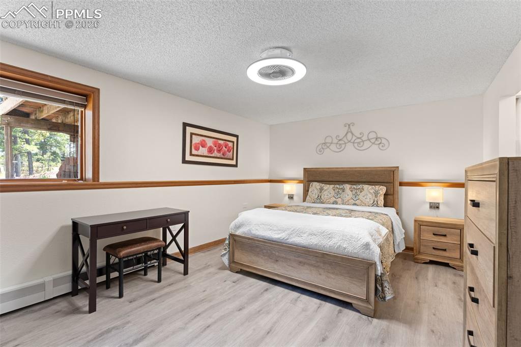 1851 Buttercup Road Elizabeth, CO 80107 - Photo 25 of 47 a bedroom with a bed and a desk