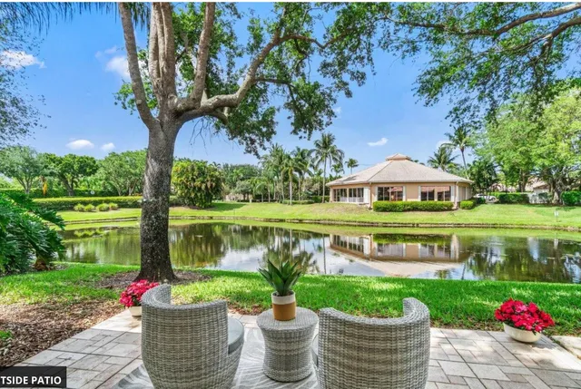 a view of house with outdoor space and lake view