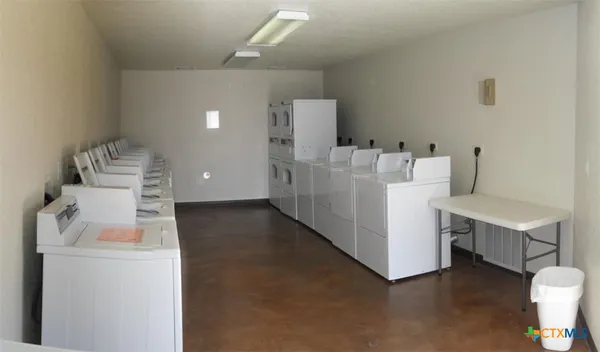 a view of a brick house with a large window