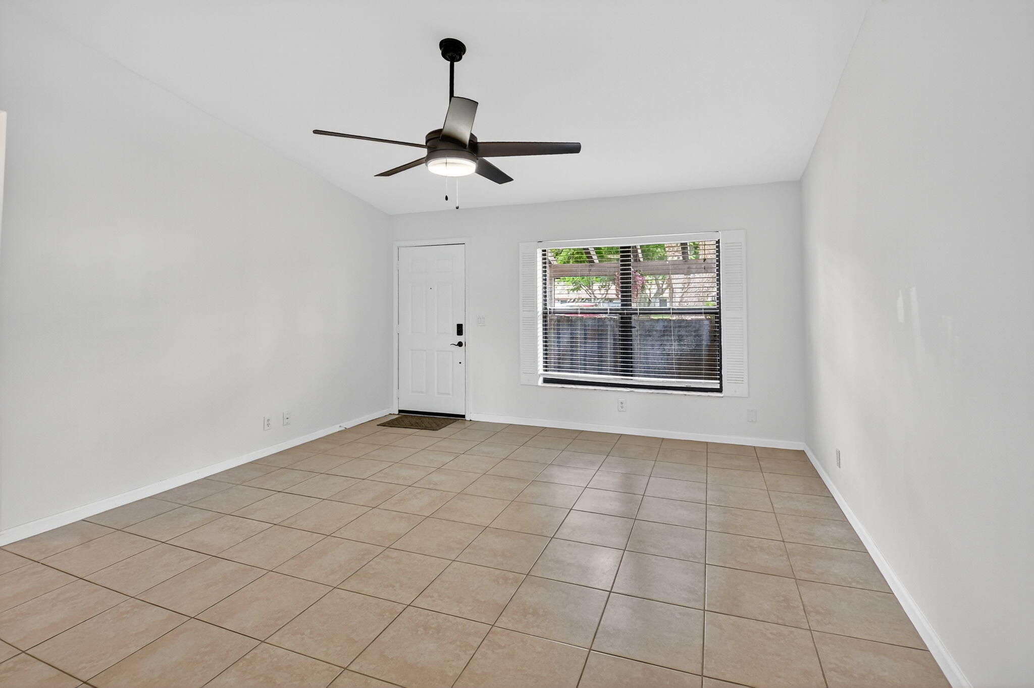 73 Vía De Casas Norte Boynton Beach, FL 33426 - Photo 13 of 60 a view of an empty room with windows