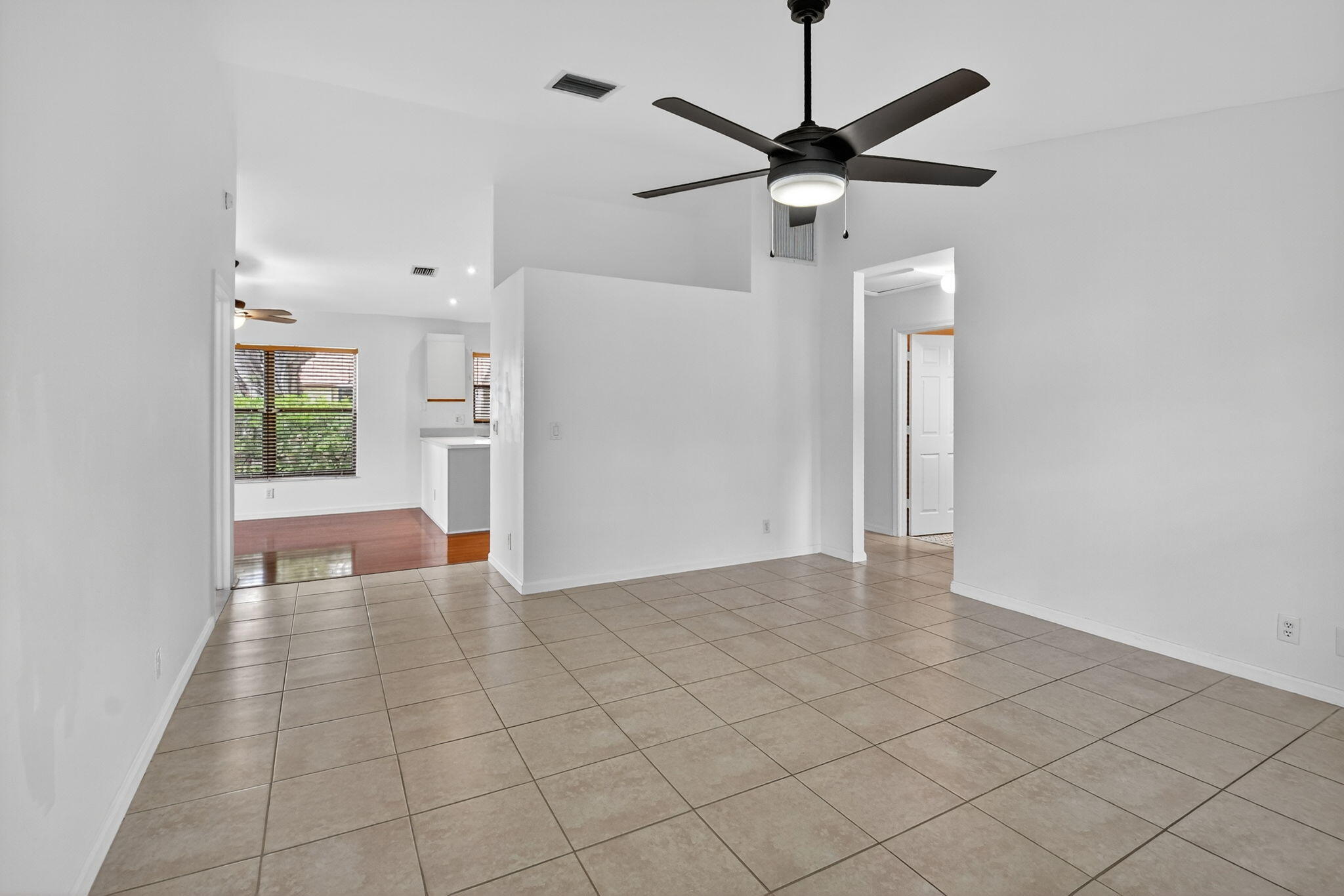 73 Vía De Casas Norte Boynton Beach, FL 33426 - Photo 15 of 60 an empty room with fan and windows