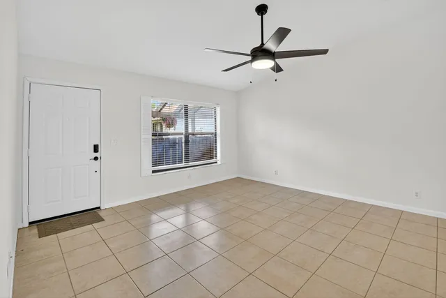 a kitchen with kitchen island a sink stainless steel appliances and white cabinets