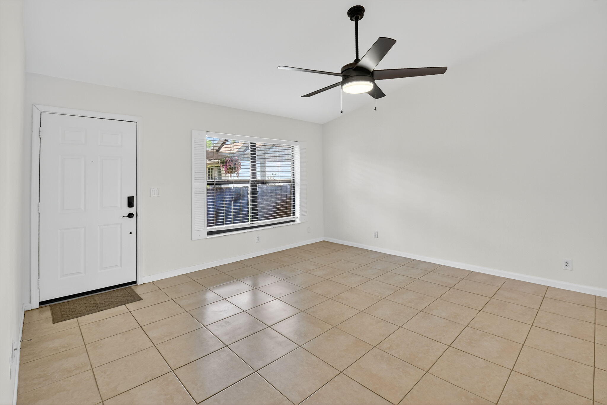 73 Vía De Casas Norte Boynton Beach, FL 33426 - Photo 16 of 60 a view of an empty room and window