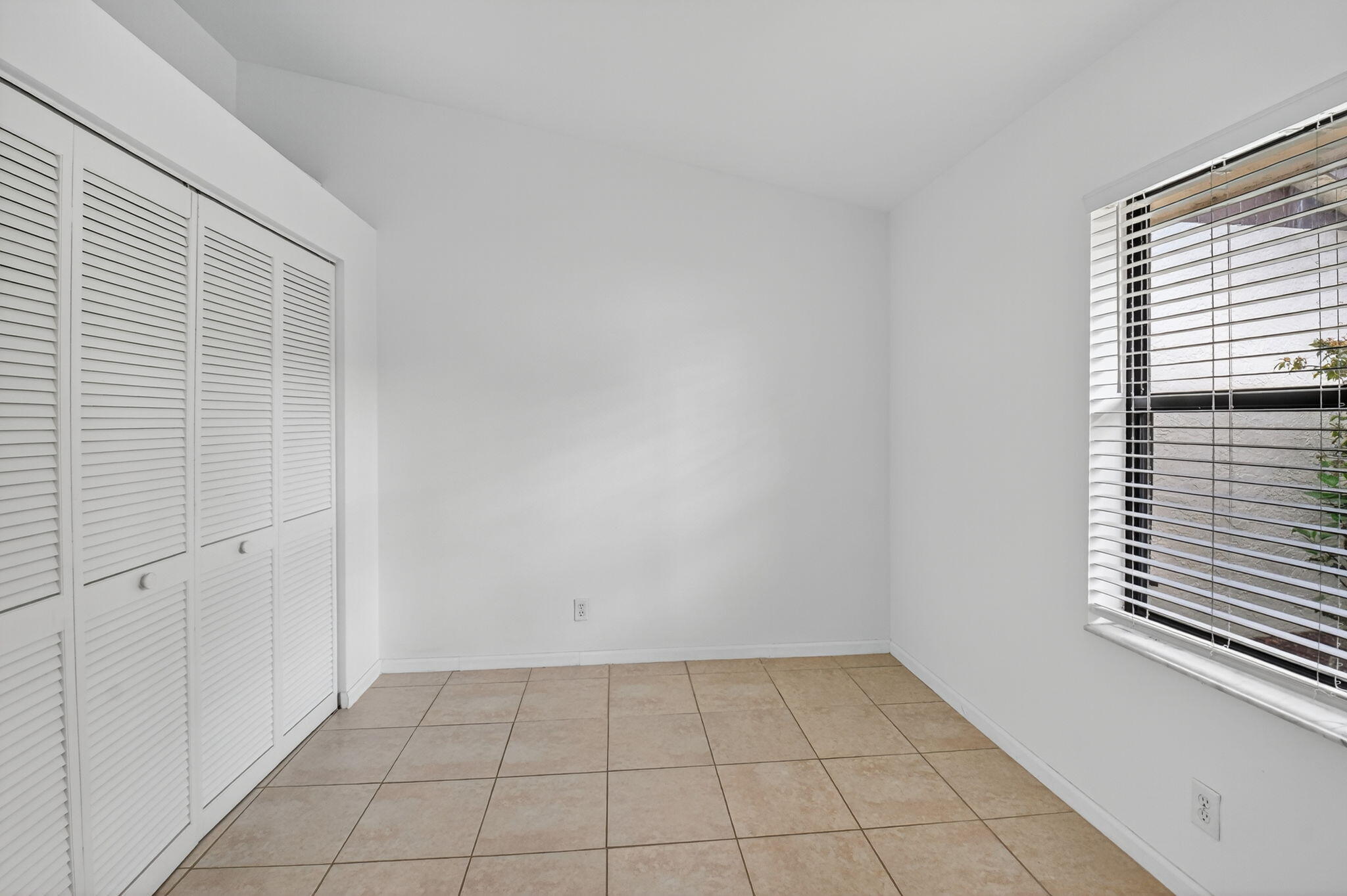 73 Vía De Casas Norte Boynton Beach, FL 33426 - Photo 30 of 60 a view of an empty room with a window
