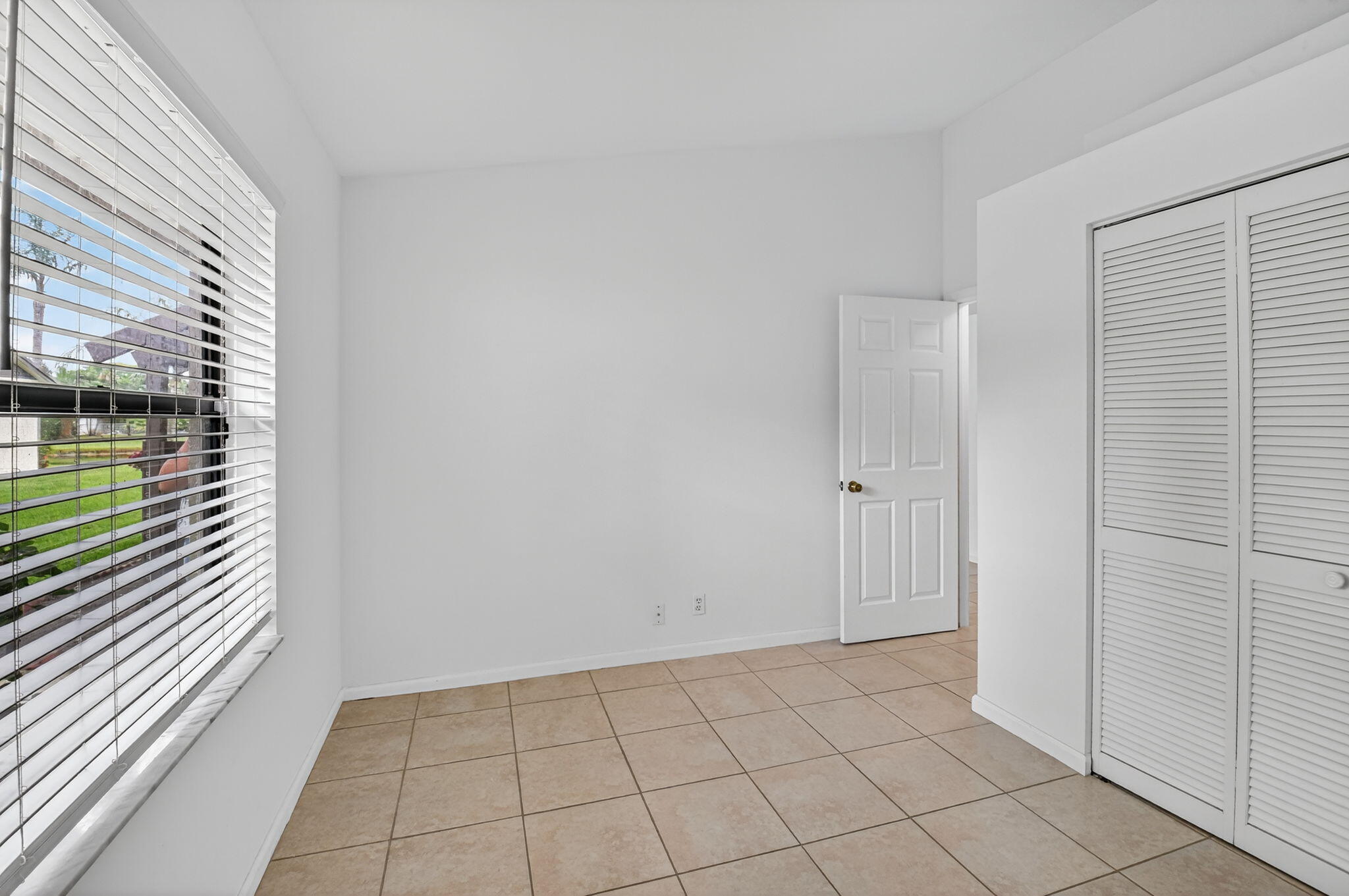 73 Vía De Casas Norte Boynton Beach, FL 33426 - Photo 31 of 60 a view of an empty room and window
