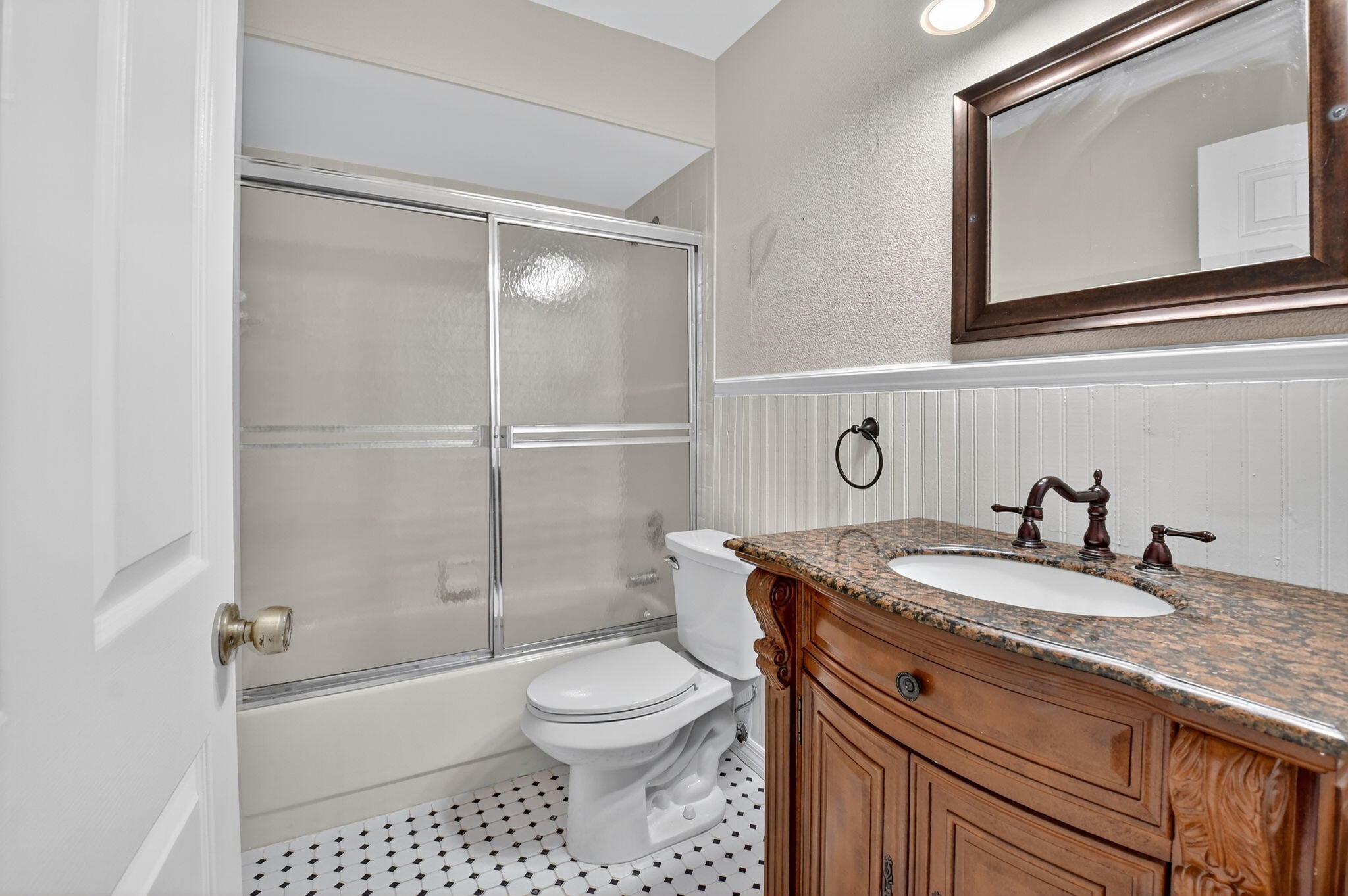73 Vía De Casas Norte Boynton Beach, FL 33426 - Photo 32 of 60 a bathroom with a granite countertop sink a toilet a mirror and shower