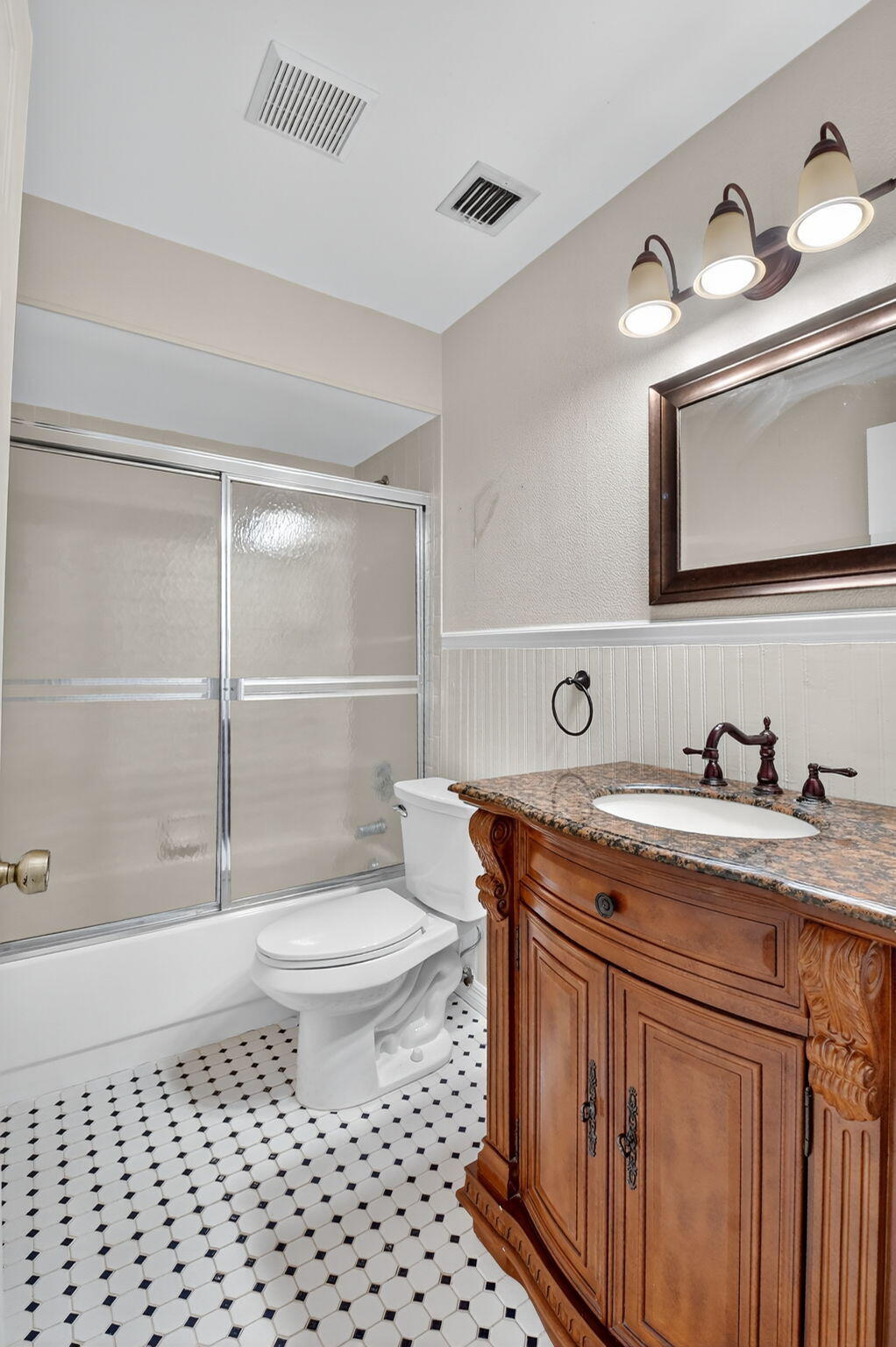 73 Vía De Casas Norte Boynton Beach, FL 33426 - Photo 33 of 60 a bathroom with a granite countertop toilet sink and mirror
