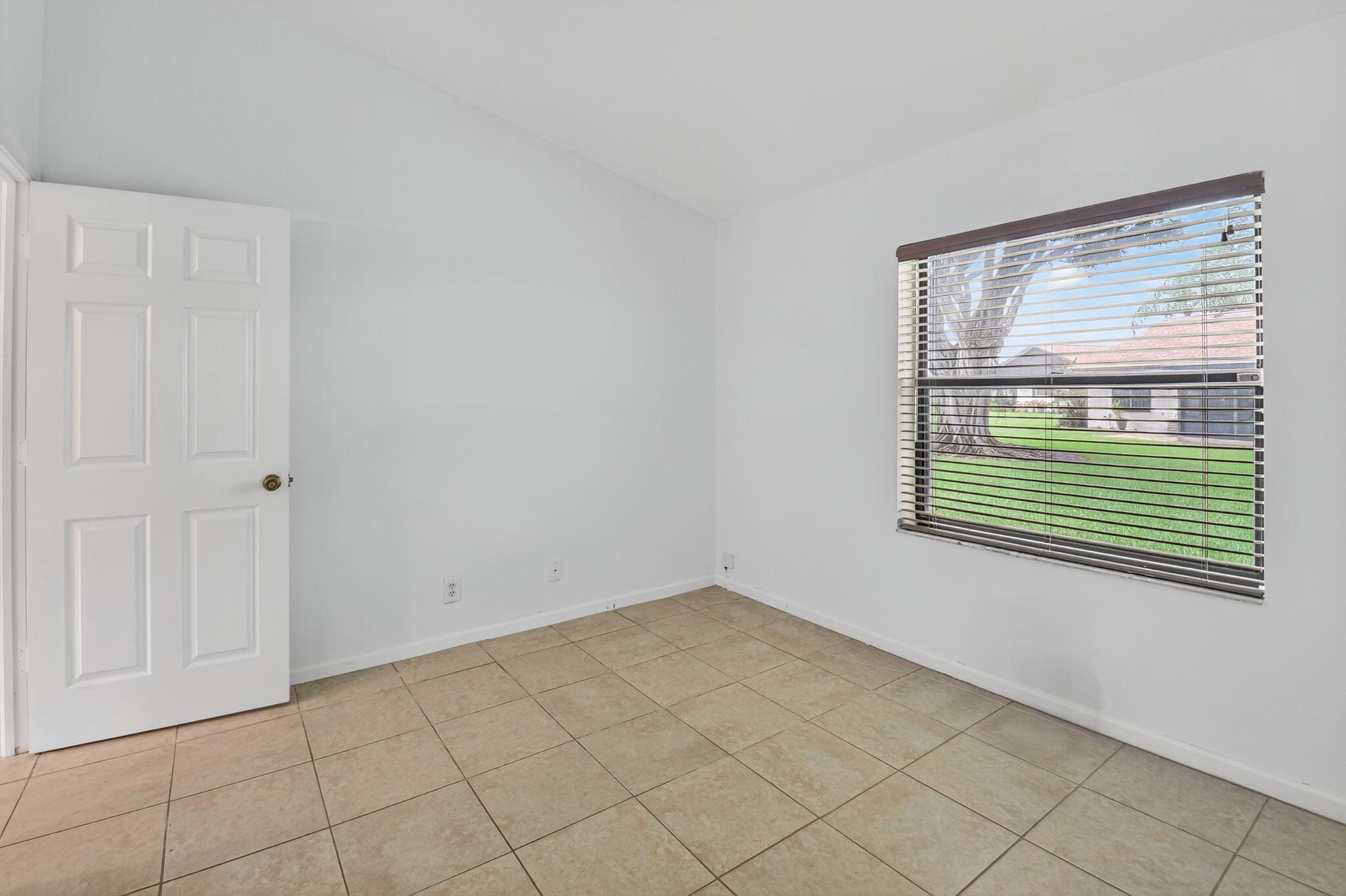 73 Vía De Casas Norte Boynton Beach, FL 33426 - Photo 35 of 60 a view of a room that has a window in it