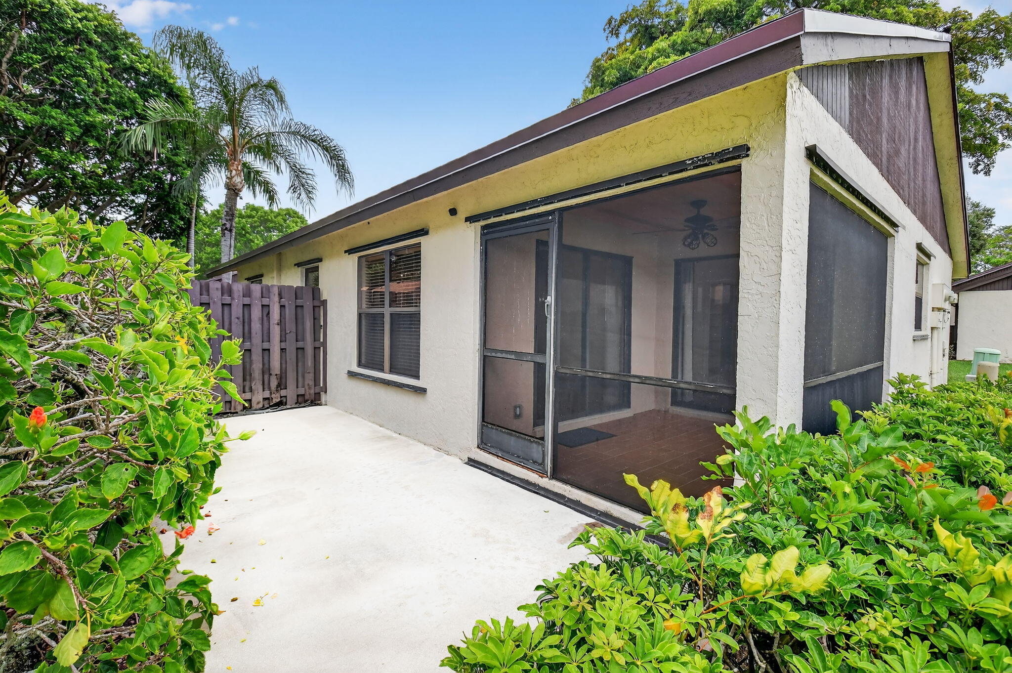73 Vía De Casas Norte Boynton Beach, FL 33426 - Photo 36 of 60 a view of house with backyard and glass windows