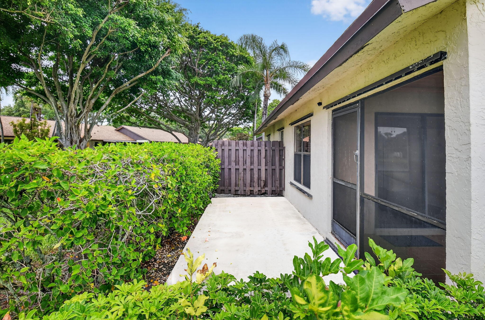 73 Vía De Casas Norte Boynton Beach, FL 33426 - Photo 37 of 60 a backyard of a house with lots of green space