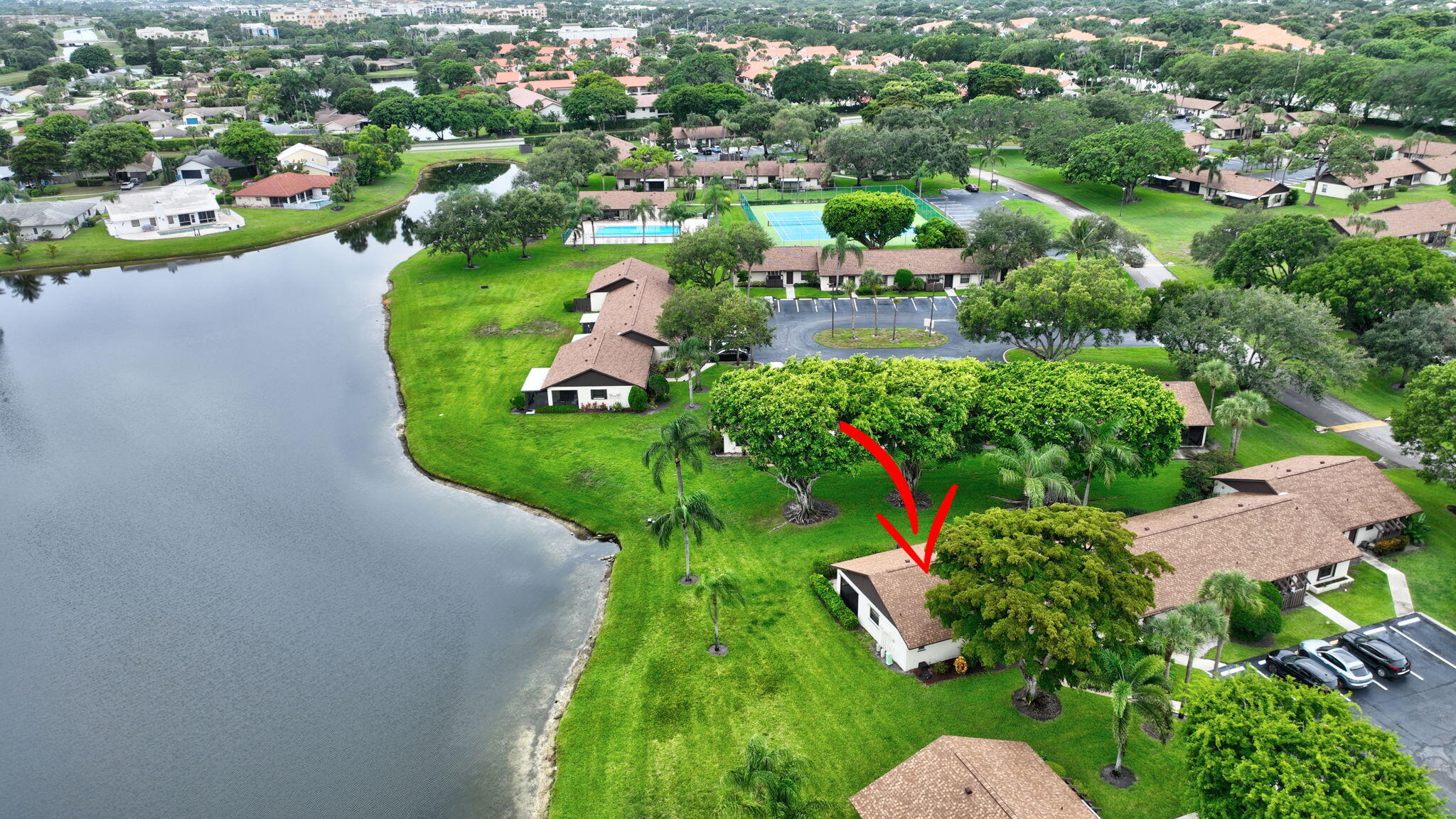 73 Vía De Casas Norte Boynton Beach, FL 33426 - Photo 38 of 60 an aerial view of residential houses with outdoor space and trees