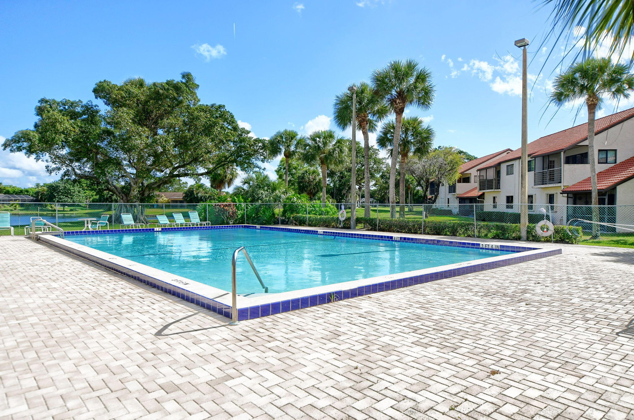 73 Vía De Casas Norte Boynton Beach, FL 33426 - Photo 39 of 60 a view of swimming pool with a yard