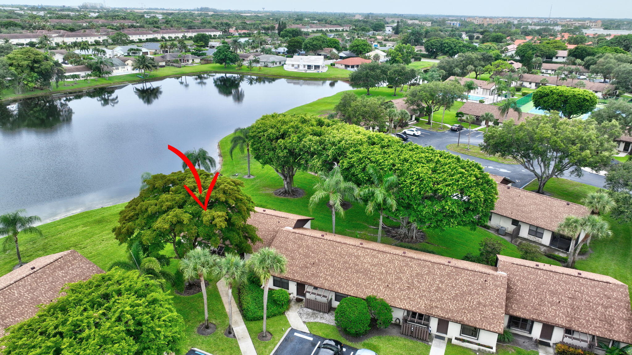 73 Vía De Casas Norte Boynton Beach, FL 33426 - Photo 42 of 60 an aerial view of house with yard and lake view