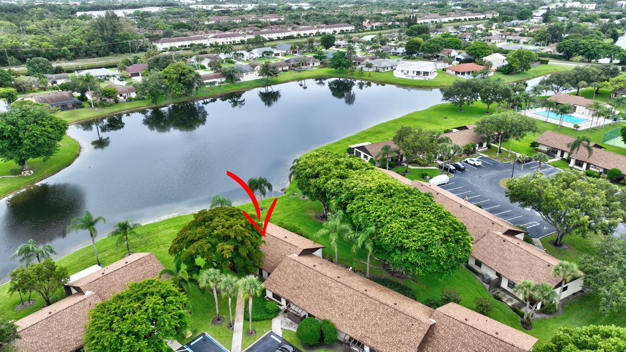 73 Vía De Casas Norte Boynton Beach, FL 33426 - Photo 43 of 60 an aerial view of lake residential houses with outdoor space and trees all around