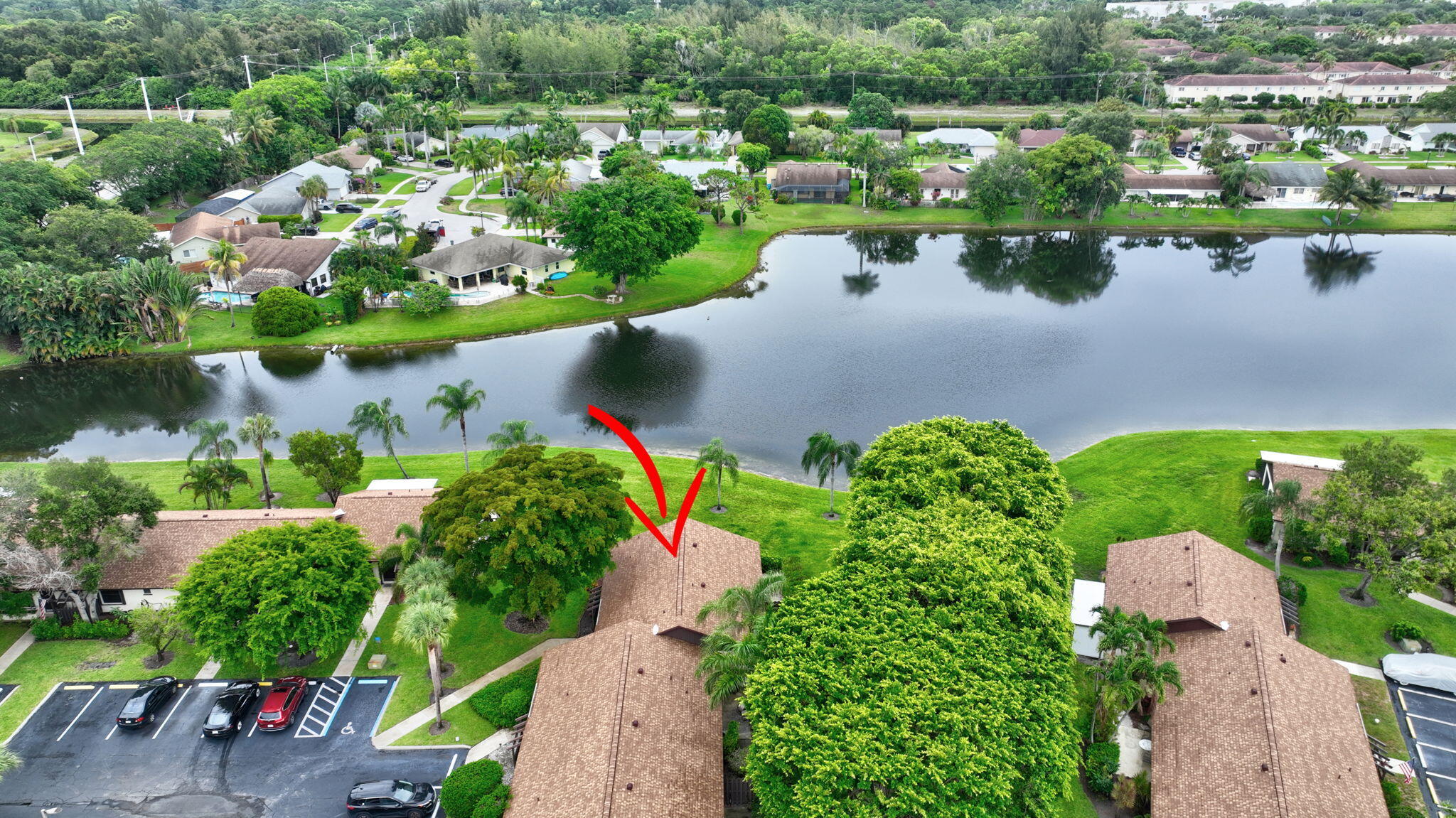 73 Vía De Casas Norte Boynton Beach, FL 33426 - Photo 44 of 60 an aerial view of a house with a lake view