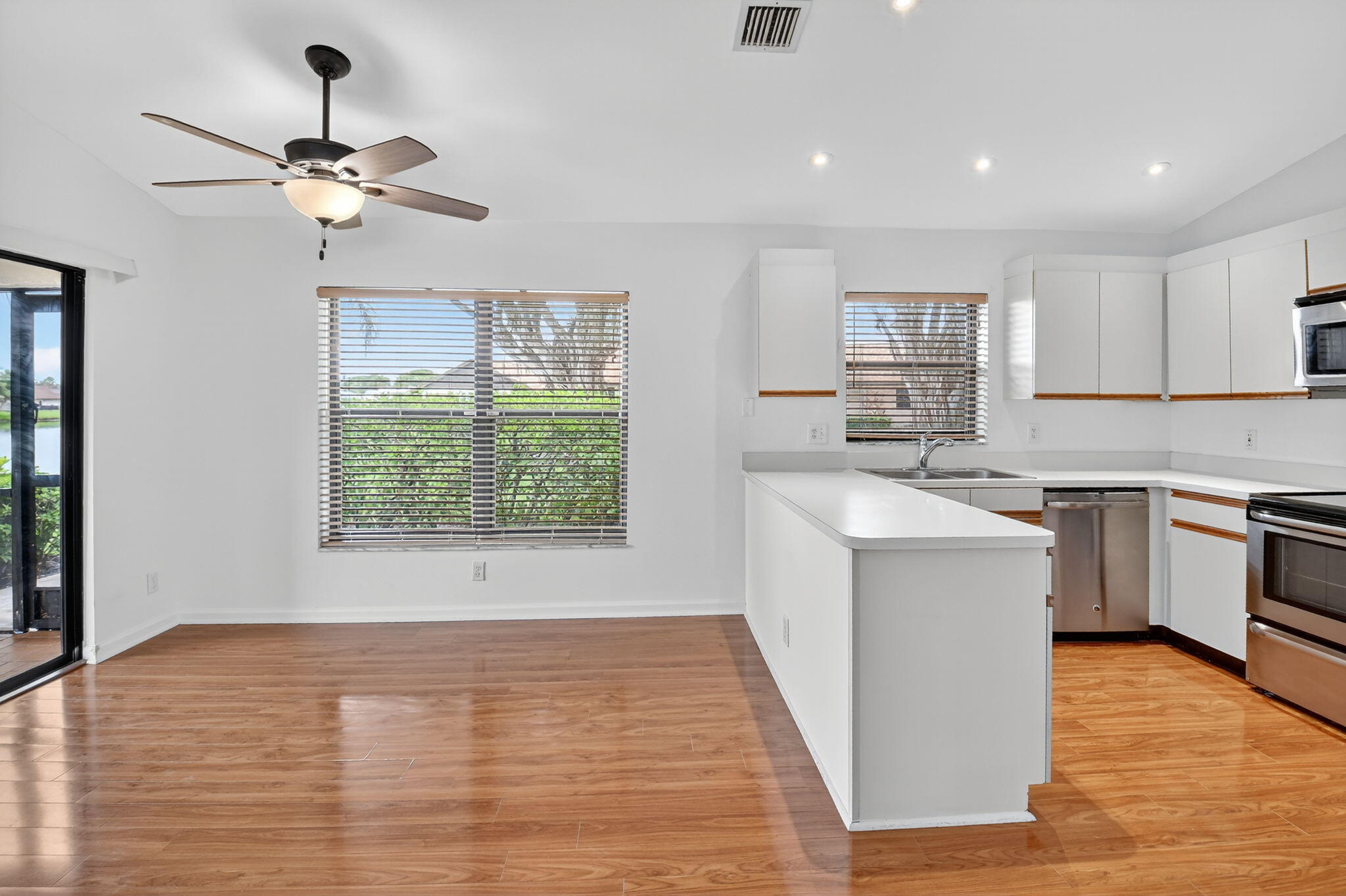 73 Vía De Casas Norte Boynton Beach, FL 33426 - Photo 5 of 60 a kitchen with a sink appliances cabinets and a window
