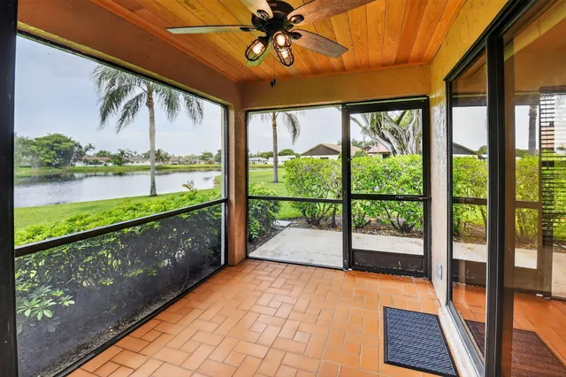 a view of a lake with houses in the back