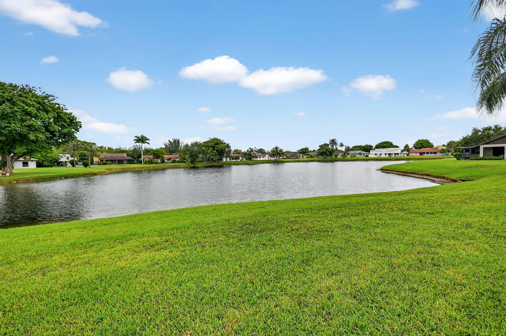 73 Vía De Casas Norte Boynton Beach, FL 33426 - Photo 10 of 60 a view of a lake with houses in the back