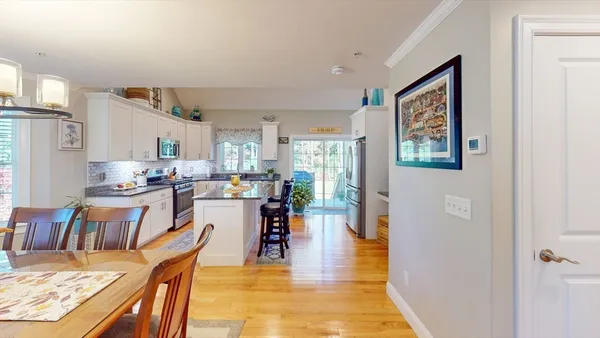 a view of a dining room with furniture window and wooden floor