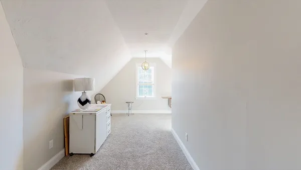 a view of entryway with a white tub