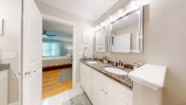 a en suite bathroom with a sink and a mirror