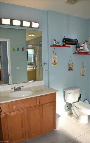 a bathroom with a tub shower and sink