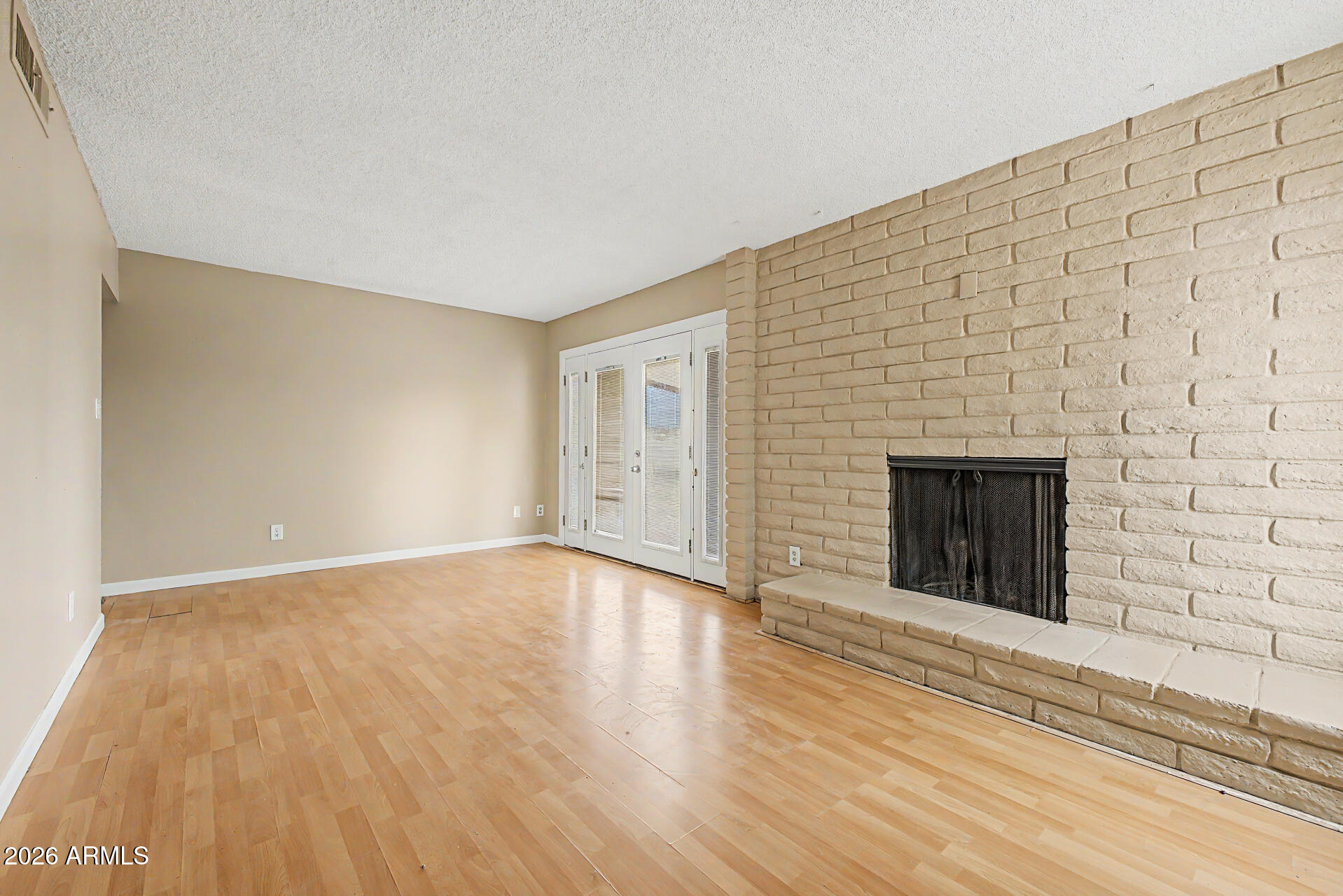 4007 West Mountain View Road Phoenix, AZ 85051 - Photo 11 of 31 a view of an empty room with wooden floor