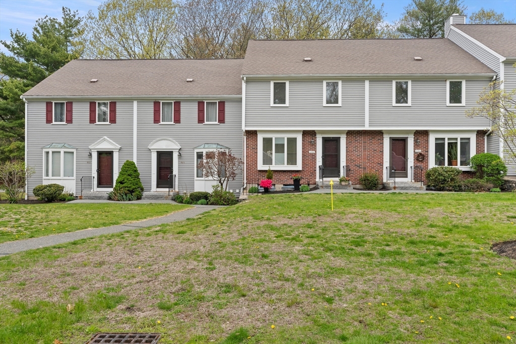 4203 Woodbridge Road, Unit 4203 Peabody, MA 01960 - Photo 27 of 31 a front view of a house with garden