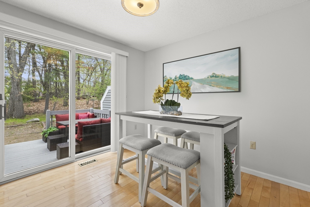 4203 Woodbridge Road, Unit 4203 Peabody, MA 01960 - Photo 5 of 31 a view of a workspace with furniture and a potted plant