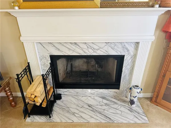 a view of a fireplace with wooden floor