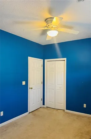 a view of a room with a table and chandelier