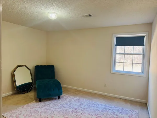 a room with a chair and a window