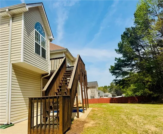 a view of swimming pool with outdoor seating and plants