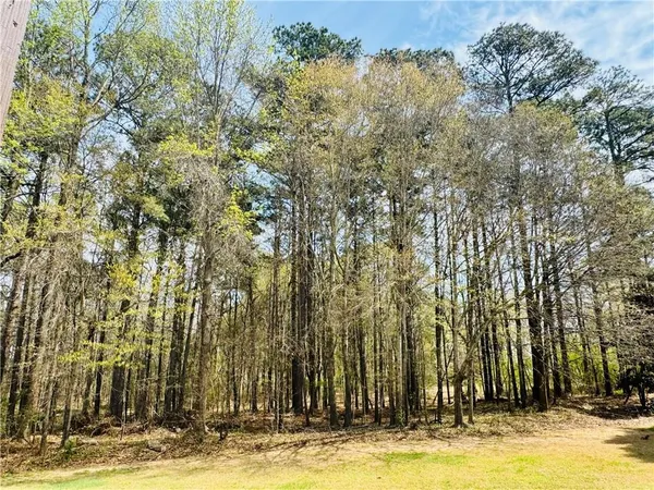 a view of swimming pool with outdoor seating and yard