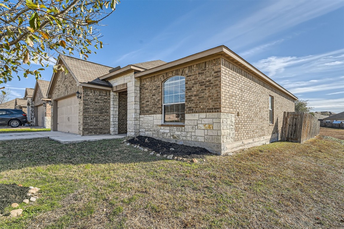 13401 Clara Martin Manor, TX 78653 - Photo 1 of 1 a view of a house with a yard