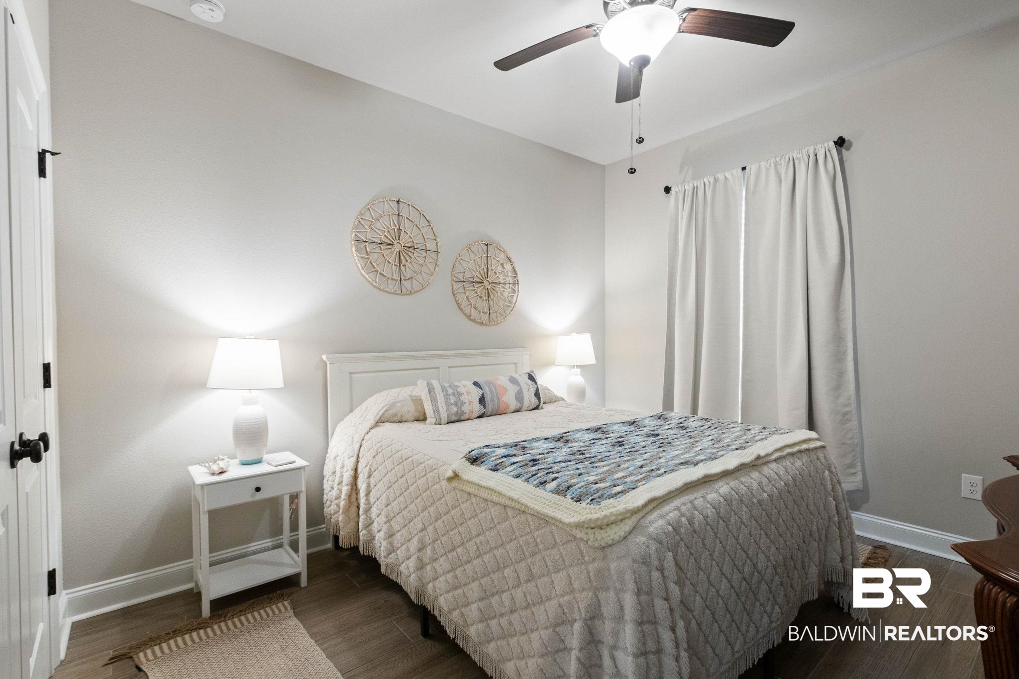 22244 Hibiscus Circle Foley, AL 36535 - Photo 35 of 51 Bedroom featuring light gray walls, wood-finish flooring, a ceiling fan with integrated lighting, and white trim molding