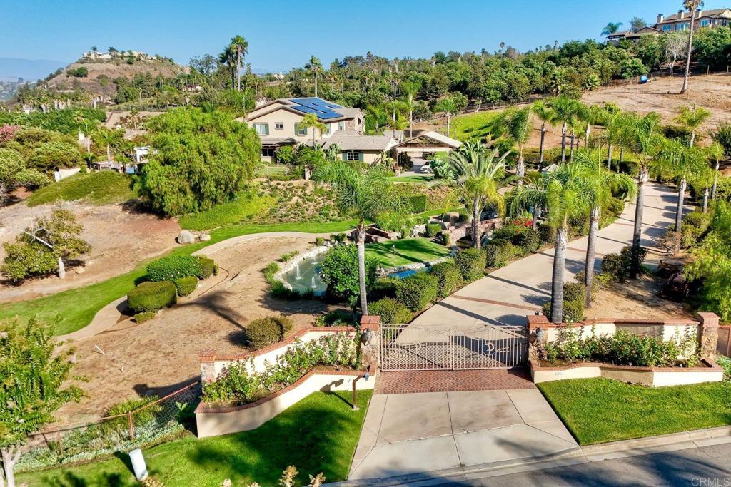 Gated entry & intercom for total privacy. Extended driveway is beautifully illuminated at evening