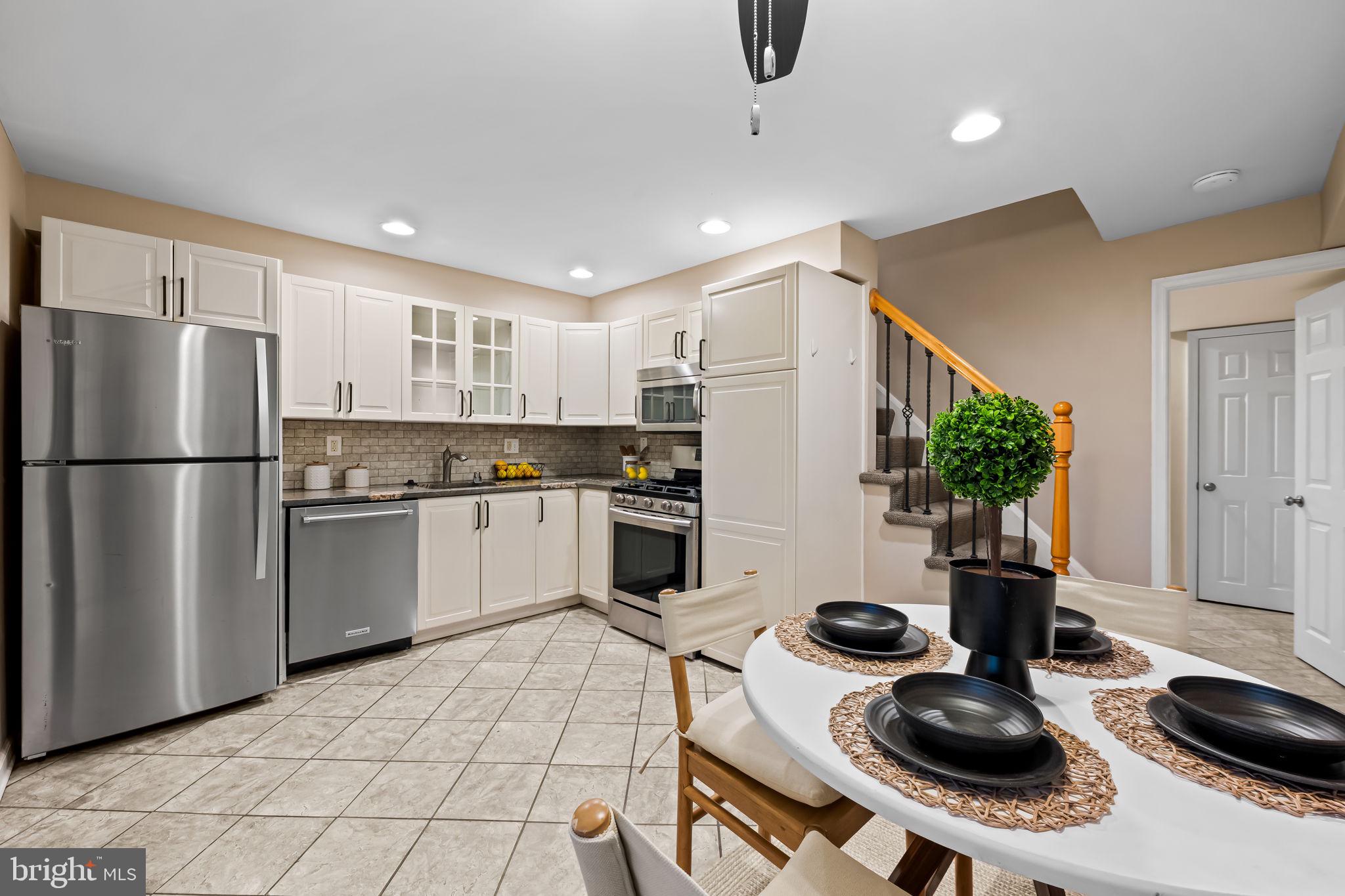 1817 Dunmere Road Baltimore, MD 21222 - Photo 9 of 27 a kitchen with a sink appliances and cabinets