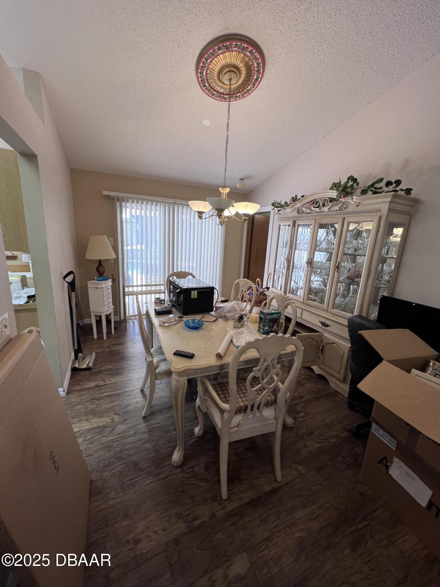 2550 Lake Ruby Road DeLand, FL 32724 - Photo 11 of 20 a view of a dining room with furniture